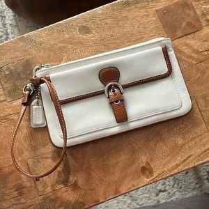 White and brown used leather Coach wristlet
